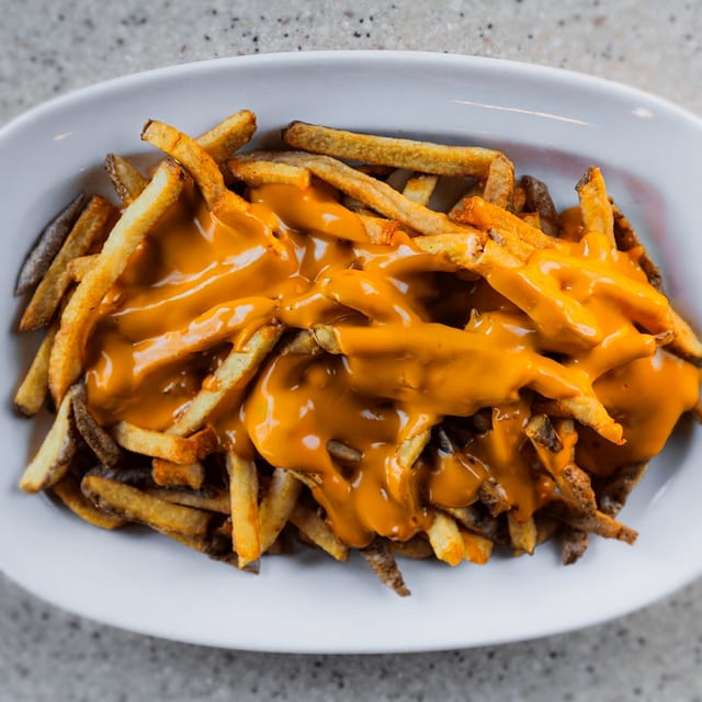 Hand Cut Cheesy Fries.